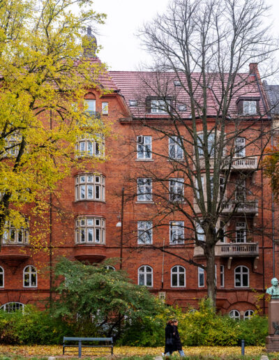 Women walking next to historic apartment building in Copenhagen Denmark