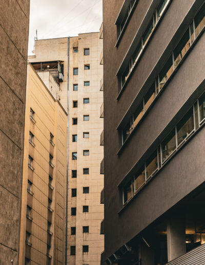 narrow perspective of high-rise apartment or office buildings in a dense urban environment in Piata Victoriei Bucharest Romania