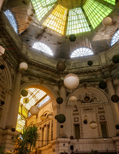 interior of the Pasajul Macca-Villacrosse (Macca-Villacrosse Passage), a fork-shaped, glass-covered arcade street located in the historic center of Bucharest, Romania