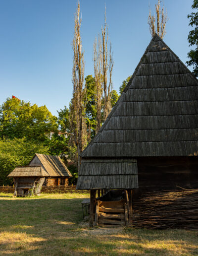 traditional wooden architecture at the Dimitrie Gusti National Village Museum in Bucharest, Romania.