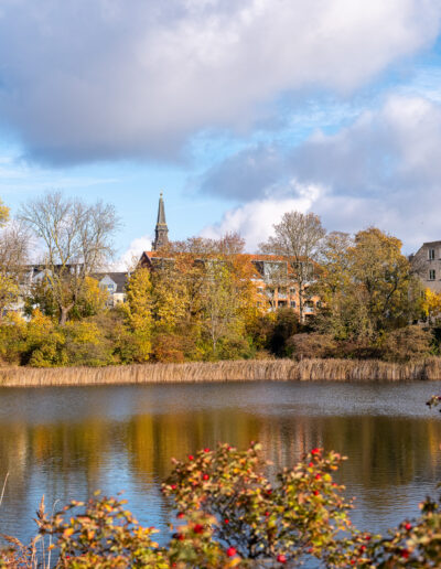Pond in autmn sorounded by buildings located in Copenhagen Denmark